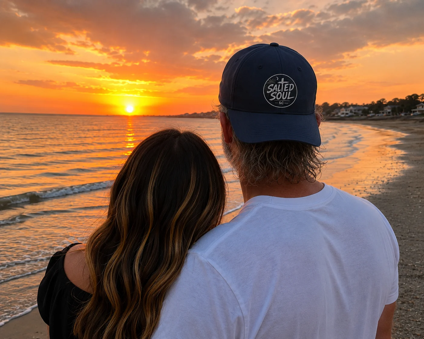 Mark and Carol watching the sunset together on a South Carolina beach